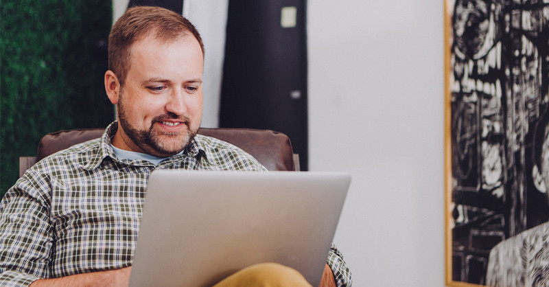 Man looking at laptop computer