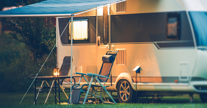 Caravan with camping chairs setup 