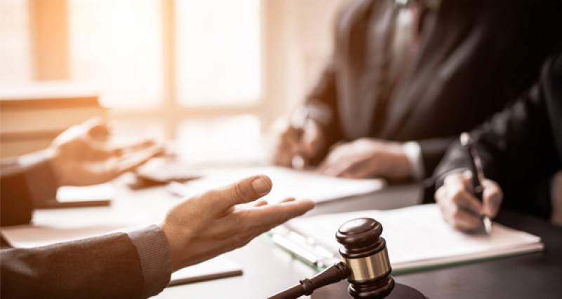 courtroom with judges hands and gavel