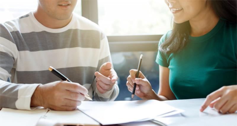 Two people having a round table conference