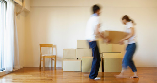 couple carrying a box