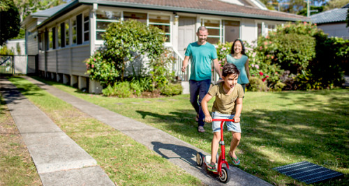 Family playing in front lawn